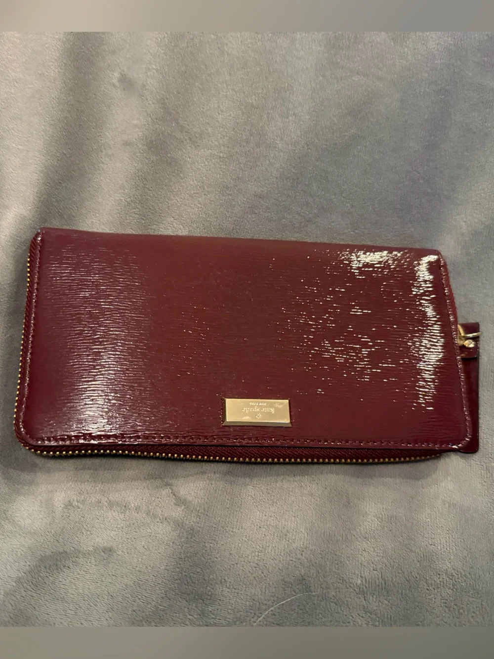 kate spade patent zip-around wallet in burgundy